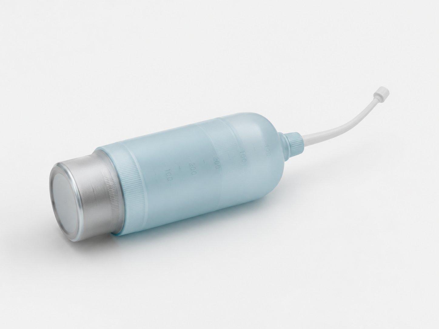Compact portable bidet bottle with angled cleansing nozzle